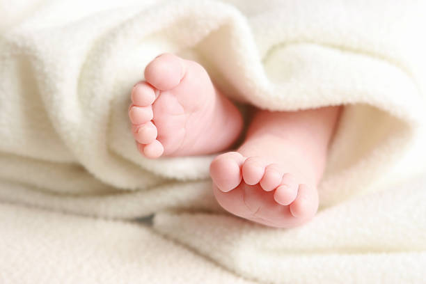 istock Baby Feet with White Soft Blanket 157394000