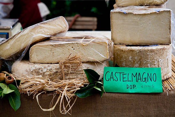 Fresh Castelmagno D.O.P. cheese on farmer's market stall, Piedmont, Italy stock photo