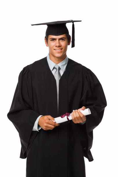 istock Boy in graduation robes holding a diploma 157394164