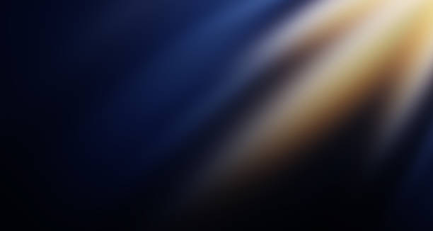 Abstract gold light ray, sun beam blur glow effect background. Gold light flash spotlight backdrop with sunlight shine.