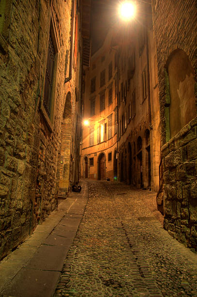 istock Illuminated street at night Bergamo 157394448