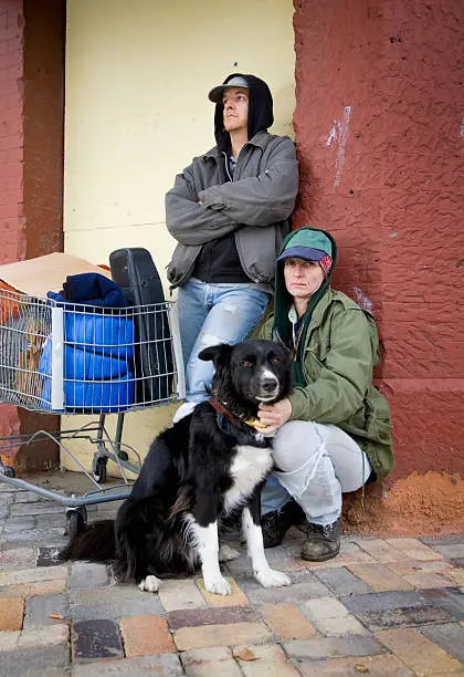 Photo of Homeless Couple on a City Street