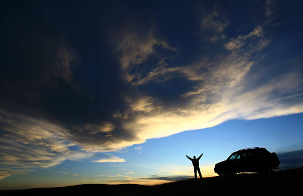 Happy Traveller Beside His SUV Vehicle stock photo