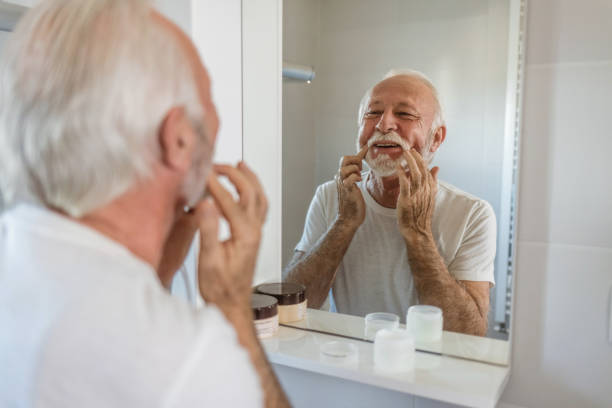 istock Senior man doing his morning routine in bathroom. 1573953017