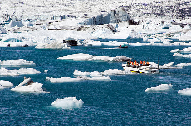 Tourist boat in icebergs in Iceland  jokulsarlon stock pictures, royalty-free photos & images