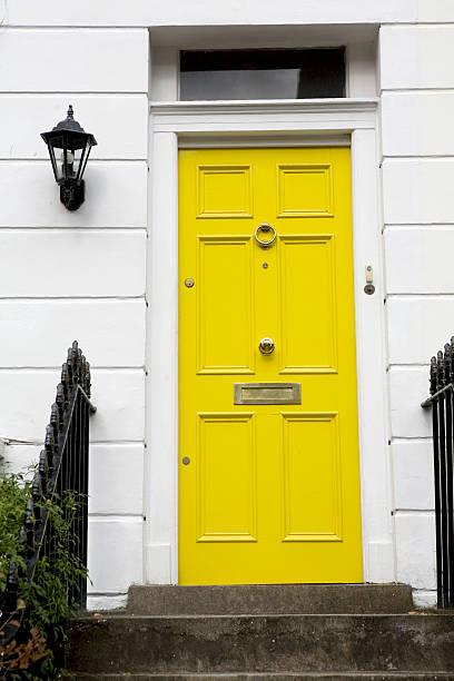 Yellow Door On Townhouse Stock Photo - Download Now - Yellow, Doorstep, - iStock