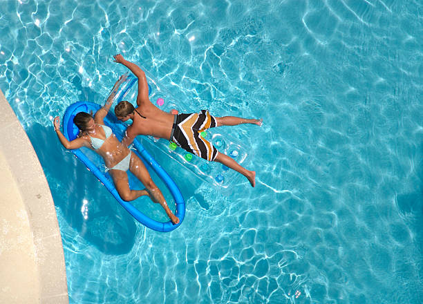 istock Young Couple Swimming on Vacation 157395626