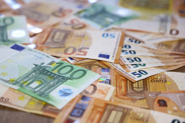 istock Euro cash money on the table 1573957167