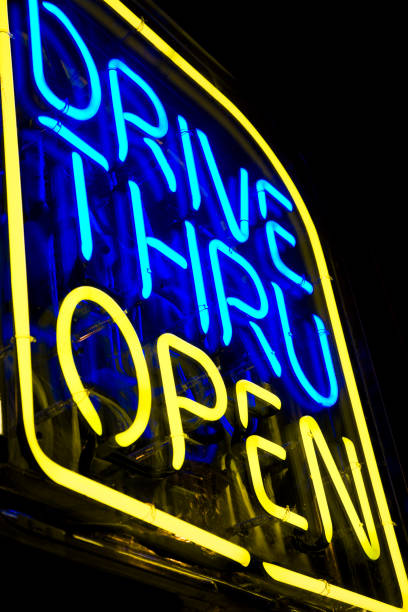 istock neon drive thru sign blue and yellow 157395742