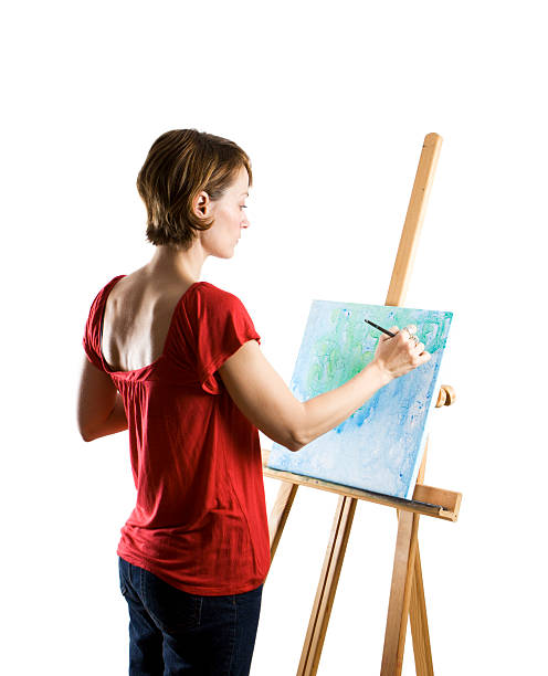 istock Woman in red busy painting artwork in white studio 157396024