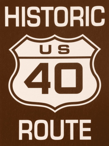 A close up of a Historic 40 Route sign in sepia.  Route 40 was an historic route that ran from Atlanta,Georgia to San Francisco, California.