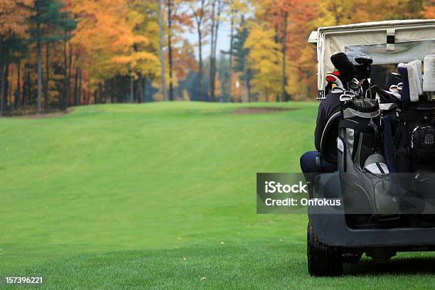Golf Player Riding In Golf Cart Towards Putting Green Stock Photo - Download Image Now