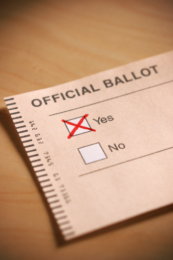 A ballot with a Yes vote cast