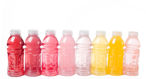 Plastic bottles of assorted carbonated soft drinks.