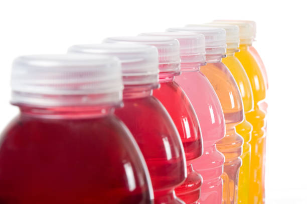 Colored Drinks Various colored nutrition drinks lined up sport drink stock pictures, royalty-free photos & images