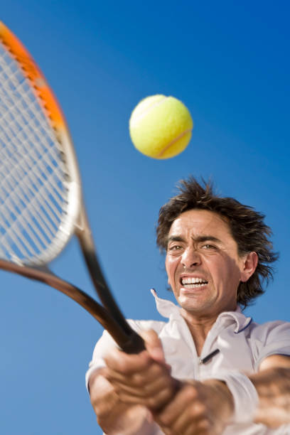 istock Blue sky over tennis player hitting the ball 157396694