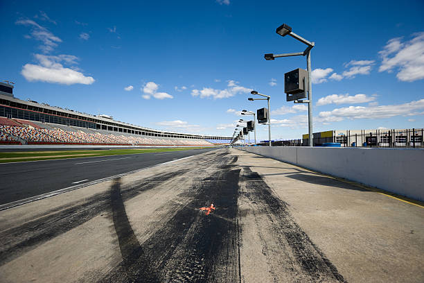 Pit Row Low angle view of pit row at a Stock car race track.      stock car stock pictures, royalty-free photos & images