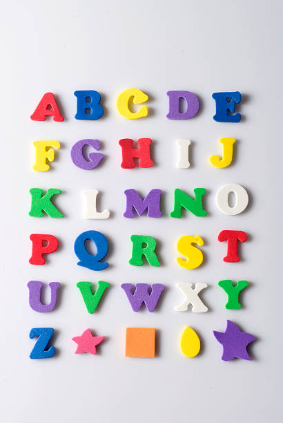 Rubber letters and shapes on white background stock photo
