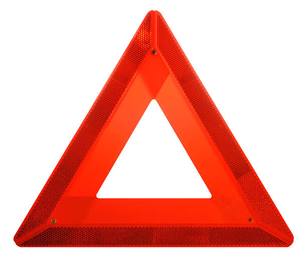 Attention: Red Hazard Danger Ahead Iconic Safety Warning Triangle Sign A red reflecting safety triangle is visible for long distances, warning traffic, usually warning of a vehicle breakdown ahead. In this model, the inner triangle is made of translucent, fluorescent material for daylight effectiveness. Outer triangle is highly reflective for night-time use. isosceles triangle stock pictures, royalty-free photos & images