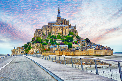 The 760-meter long Jetty Bridge serves as access to Mont Saint-Michel monastery was designed by Dietmar Feichtinger is located in Normandy, France