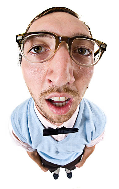 Fish Eye Nerd Guy Isolated on White A big headed, tired looking, nerdy IT student young ma; isolated on a white studio background.  Vertical with copy space. fish eye lens stock pictures, royalty-free photos & images