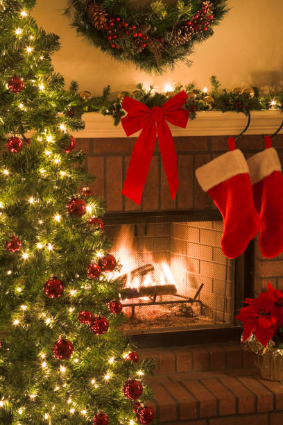 istock Christmas tree and decor around the fireplace with blazing fire 157398544