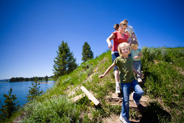 Family Hike by the River, Yellowstone National Park. . stock photo