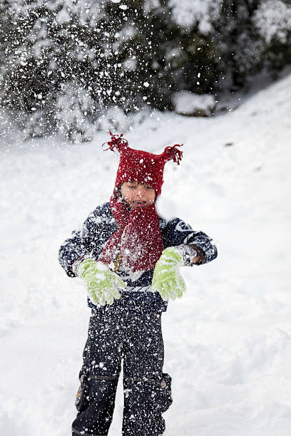 Child In Snow Young child playing in a snow. Canon 5D Mark II. mm1 stock pictures, royalty-free photos & images