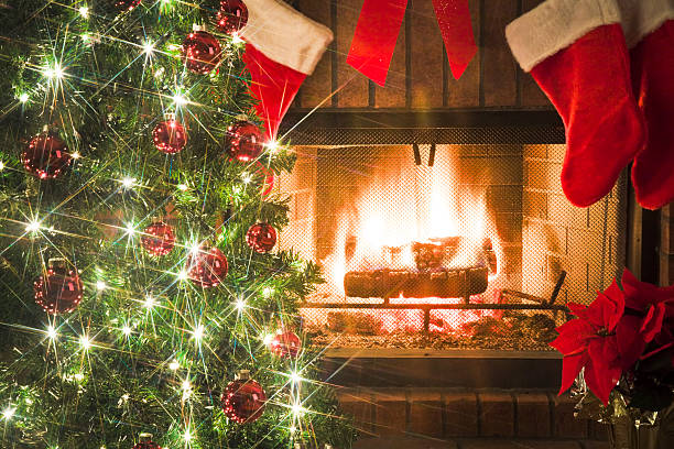 istock Christmas tree and decor around the fireplace with blazing fire 157398702