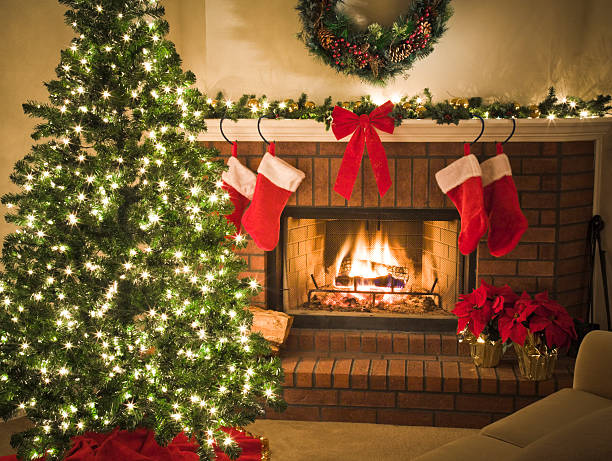 istock Comfortable sofa by blazing fireplace and decorated Christmas tree 157398706