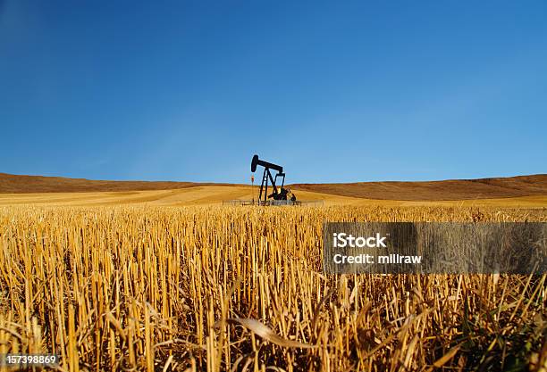 Black Oil Well Pumpjack With Blue Sky Stock Photo - Download Image Now - Oil Well, Alberta, Oil Pump