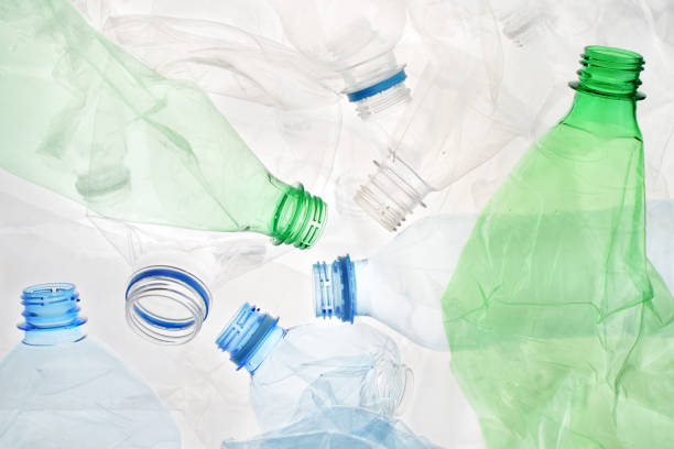 istock Transparent plastic bottle crumpled plastic recycling waste sorting. Pile of bottles PET recycling bottles background. Crushed bottle smashed plastic background. Recyclable materials. Disposable. Used 1573990004