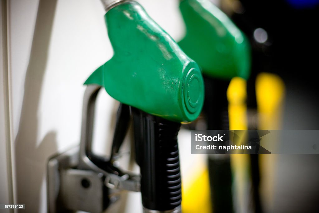 Green pump Detail of a green petrol pump in a petrol station. Fuel Pump Stock Photo