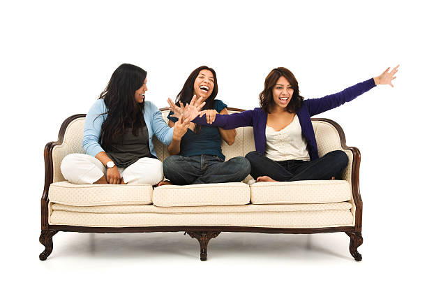 istock Mother and Daughters Laughing on White Antique Sofa 157399619