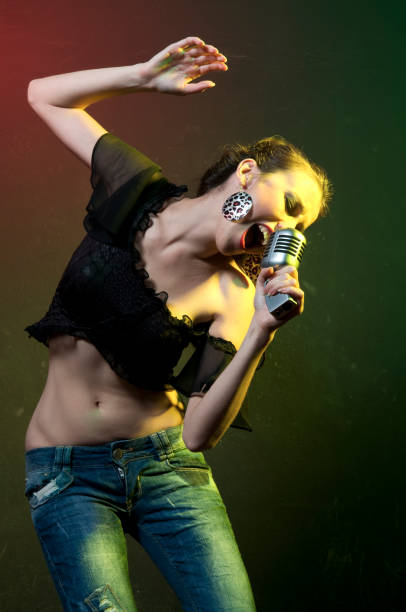 istock young beautiful woman singing 157399680