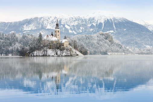 Lake Bled located in Slovenia Europe. There is a church on the island and old castle on a rock above the lake.