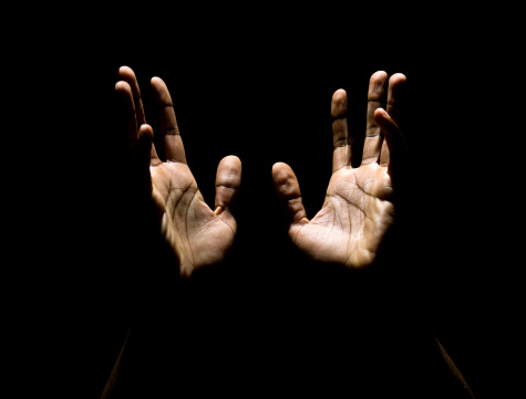 african american male hands raised to heaven in a pray  (this picture has been taken with a Hasselblad H3D II 31 megapixels camera)