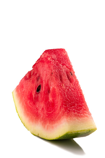 macro sliced watermelon,Red watermelon triangular piece on white blackground