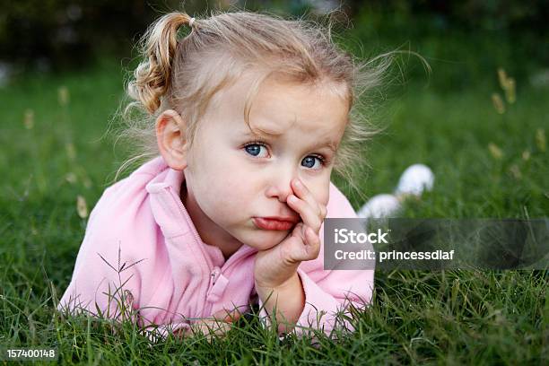 Girl In The Grass Stock Photo - Download Image Now - Blond Hair, Pigtails, Toddler