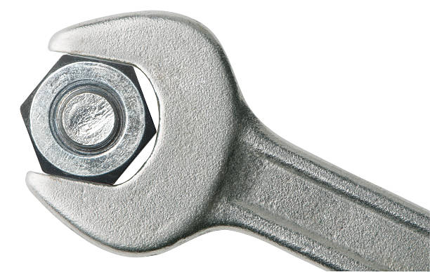 Steel gray wrench clasping a bolt close-up wrench and bolt nut,with clipping path nut fastener stock pictures, royalty-free photos & images