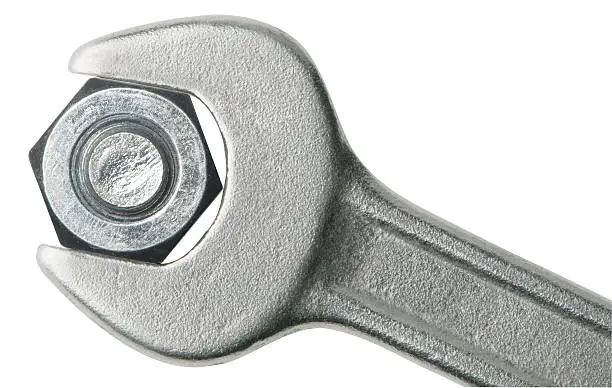 Photo of Steel gray wrench clasping a bolt