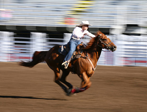 istock Galloping horse with rider at a rodeo 157400511