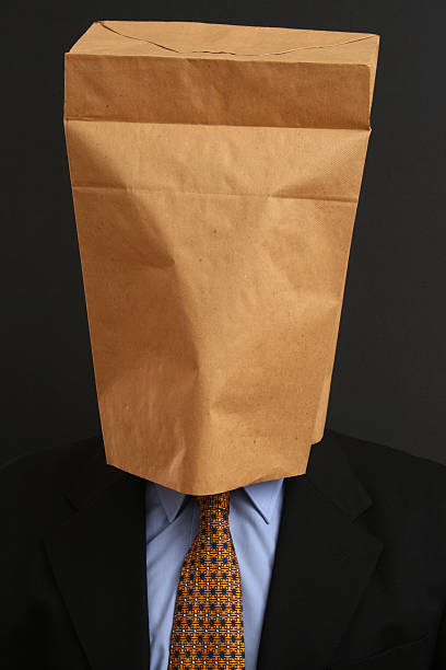 Anonymous businessman Businessman with paper bag on his head embarrassment unrecognizable person wearing a paper bag human head stock pictures, royalty-free photos & images