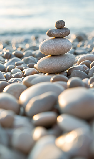 Close-up view of balanced stones on the beach