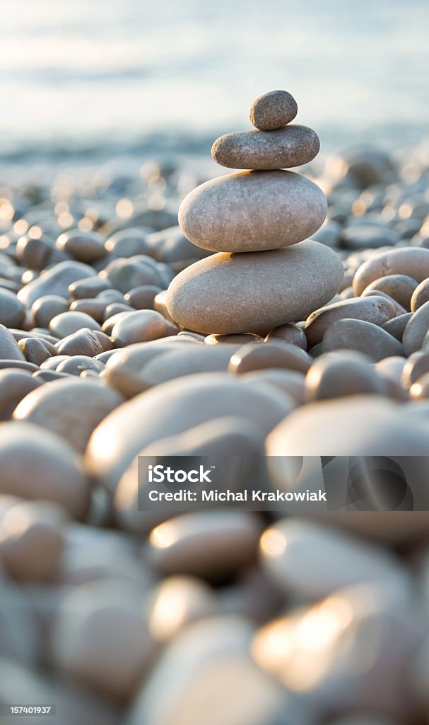 Stacked pebbles on a beach Stone composition on the beach. Stone - Object Stock Photo