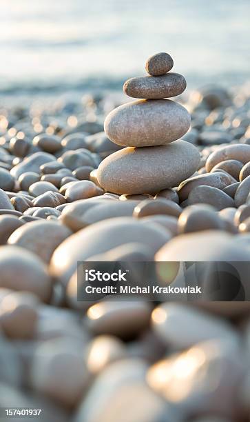 Stacked Pebbles On A Beach Stock Photo - Download Image Now - Stone - Object, Zen-like, Built Structure