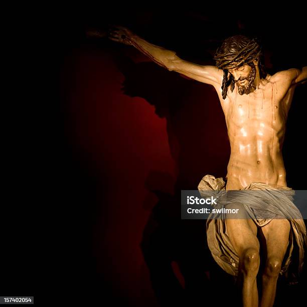 Model Of The Crucifixion On A Red Background Stock Photo - Download Image Now - Art, Art And Craft, Blood