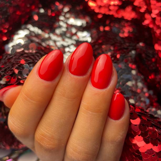 istock Red Nails Almond Shaped Gel Nails 1574020959