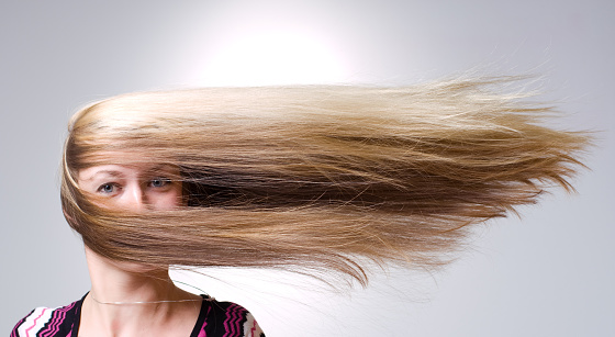 Strong wind blows on woman's hair

From the same series:
[url=http://www.istockphoto.com/file_closeup.php?id=8020524][img]http://www.istockphoto.com/file_thumbview_approve/8020524/2/istockphoto_8020524-typhoon.jpg[/img][/url]