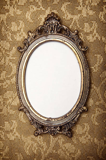Antique Vintage Picture Frame Close up of a grungy antique frame on retro floral wallpaper with ornate decor.  White copy space available for the picture of your choice. vanity mirror photos stock pictures, royalty-free photos & images
